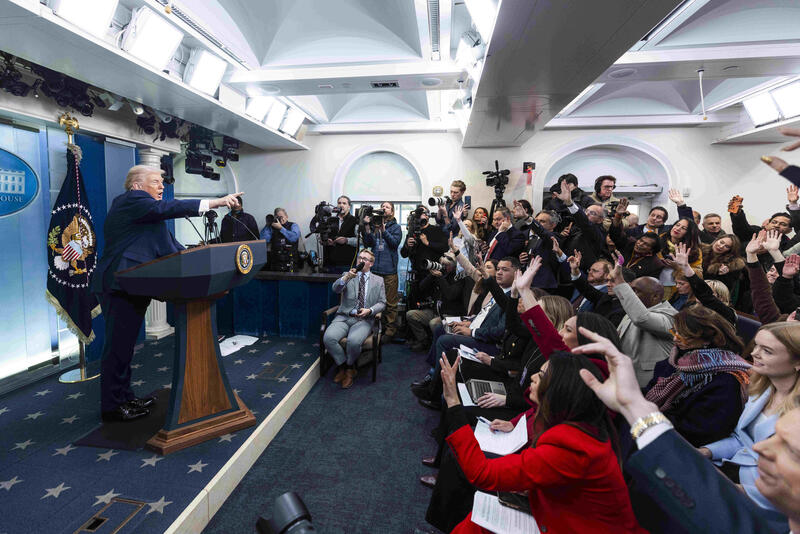 US President Trump speaks on to reporters ahead of trip to Davos