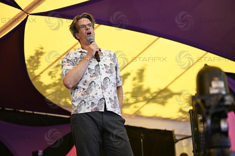 Marcus Brigstocke performing at Latitude Festival