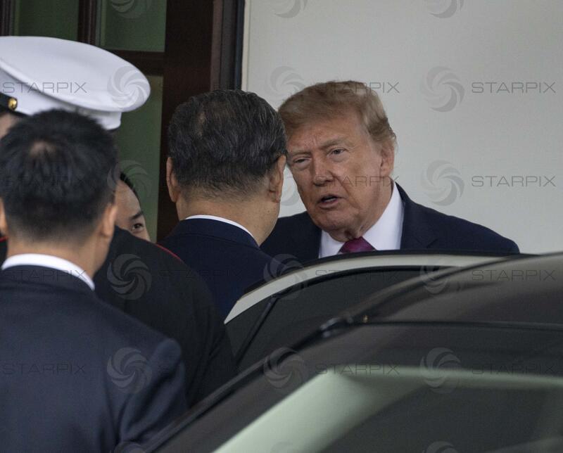 President Donald Trump escorts President Xi Jinping of China out of the White House